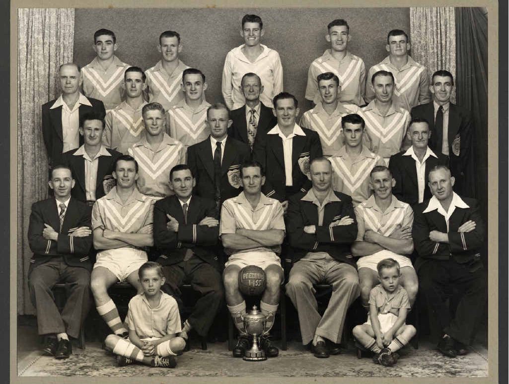 HISTORIC LINKS: A photo of the 1955 premiership-winning Bundamba Rangers side which has historic importance. Among the players were Col and Keith Kitching and Ray Rule, whose grandsons now play for the Western Pride. Former Australian player George “Fat’’ Kitching was manager of the 1955 team and his son George was mascot. Young George’s brother Wally Kitching was the ball boy. Mascot George later became father of another Australian player, Belinda Kitching. Other greats in the successful side included Spencer Kitching, Bob Lawrie, Norm Rule and Graham Kathage. HISTORIC LINKS: A photo of the 1955 premiership-winning Bundamba Rangers side which has historic importance. Among the players were Col and Keith Kitching and Ray Rule, whose grandsons now play for the Western Pride. Former Australian player George “Fat’’ Kitching was manager of the 1955 team and his son George was mascot. Young George’s brother Wally Kitching was the ball boy. Mascot George later became father of another Australian player, Belinda Kitching. Other greats in the successful side included Spencer Kitching, Bob Lawrie, Norm Rule and Graham Kathage.